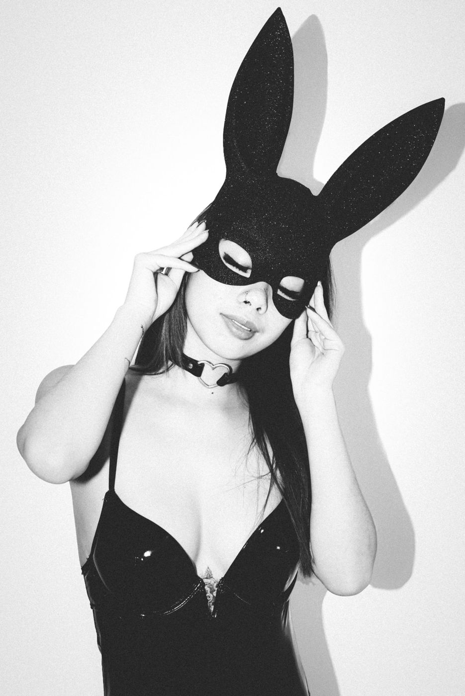 Playful black and white portrait with a satin mask